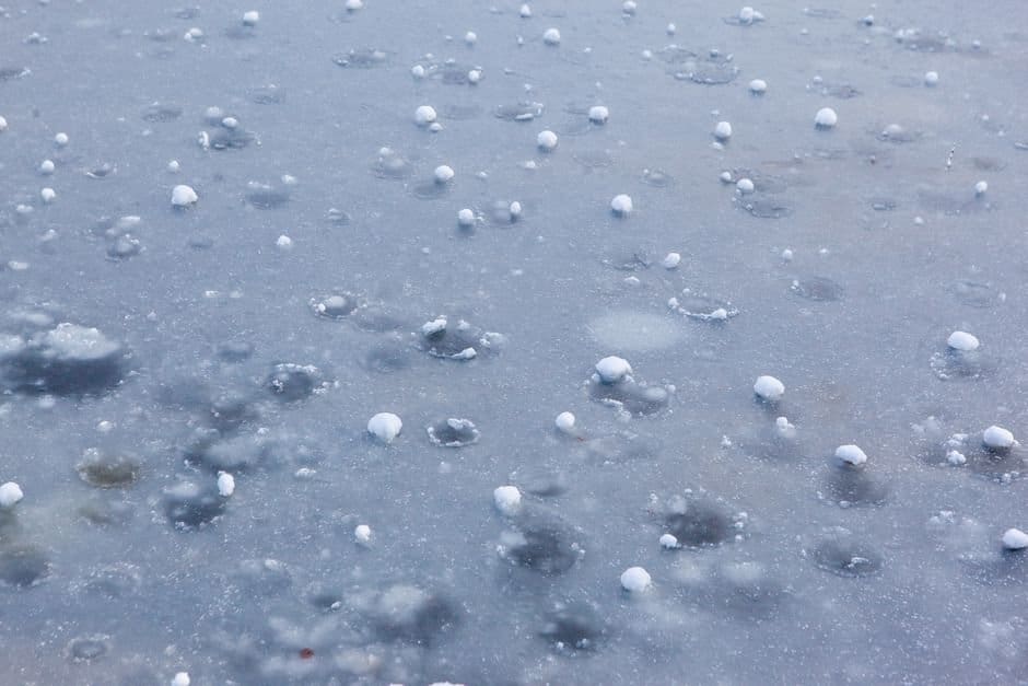 Hail on the ground after a storm, the kind of evidence to photograph when deciding what to do after a hailstorm